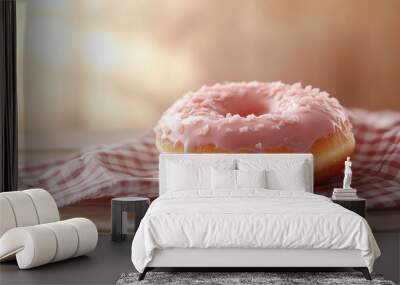 A delicious and appealing donut is displayed on a checkered cloth,with a warm background like beige. Wall mural