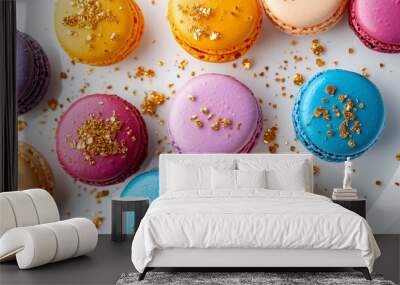 Colorful macarons on a white plate with some sprinkled with edible gold flakes for a luxurious touch Wall mural