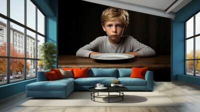 child boy sit with empty plate Wall mural