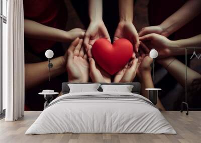 woman hands hold heart isolated on black Wall mural