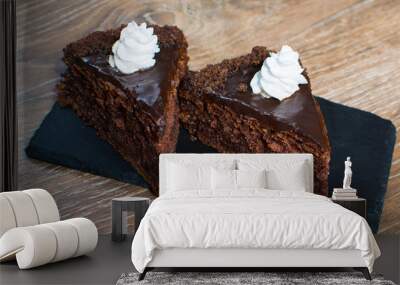 two pieces of cake on a stone plate Wall mural