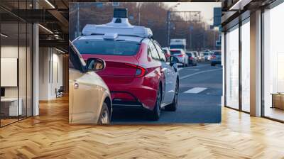 taxi car with autopilot in the city traffic Wall mural