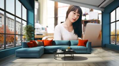 Asian teenager woman using laptop for study online. Wall mural