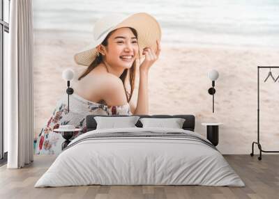 Happy smile young adult asian woman relax at beach on day. Wall mural