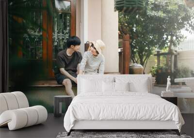 Young adult asian lover couple together living at home garden terrace on day. Wall mural