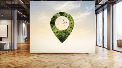 Green location symbol of pin. A green forest shape on location pin concept of green place for tourist or visit. Green Destination. Environment day concept. World Forestry Day. Wall mural