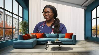 Portrait of a happy African American female healthcare professional, portrait of a nurse with stethoscope Wall mural