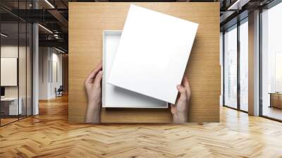 woman hand hold a paper on the wood table(background) Wall mural