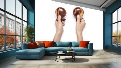 woman hand hold a wood castanets isolated white Wall mural