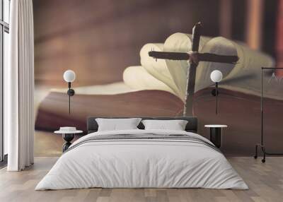 Ancient religious book and wooden cross on the background of a wooden and burlap Wall mural