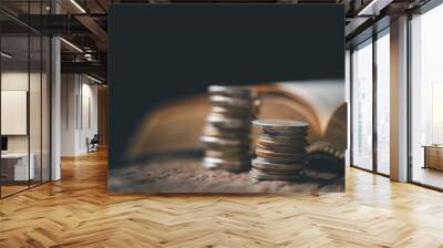 One tenth or tithe is basis on which Bible teaches us to give one tenth of first fruit to God. coins with Holy Bible. Biblical concept of Christian offering, generosity, and giving tithes in church. Wall mural