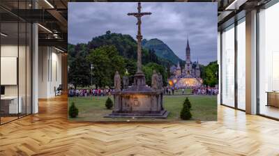 Pilgrims partaking in La Procession Mariale Aux Flambeaux or the Torchlight Marian Procession in Lourdes Wall mural