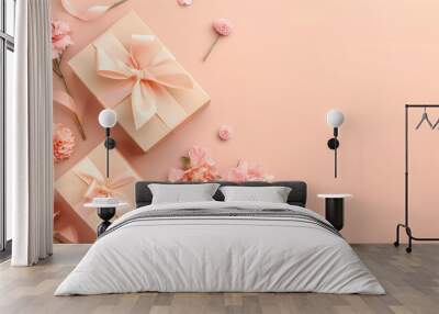 Mother's Day concept. Top view photo of two trendy gift boxes with ribbon bows and carnations on solid pastel peach color background with copy space Wall mural