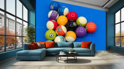 billiard balls lined up on a table Wall mural