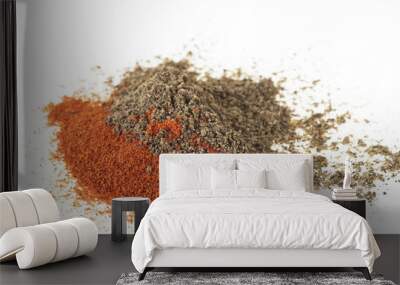 Pile of red and black pepper powder on a white background Wall mural