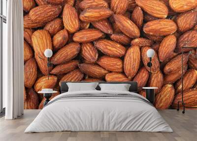 Pile of salted and roasted almond as background. Salted and tasty. Wall mural