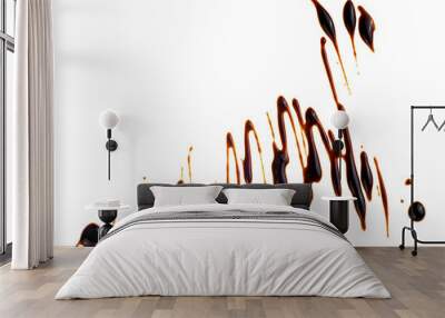 Splashes of sweet chocolate syrup isolated on a white background, top view. Melted chocolate sauce. Wall mural