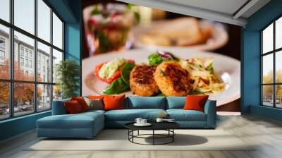 Crab cake appetizer on a white plate. Wall mural