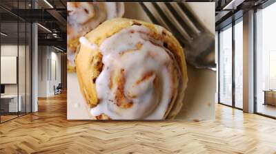 macro photography of two sweet rolls with white frosting running down the sides Wall mural