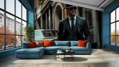 Stylish Man in Suit and Hat Walking in City Street with Vintage Car Wall mural