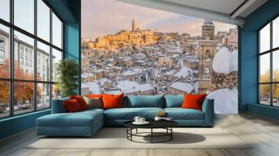 panoramic view of typical stones Sassi di Matera and church of Matera 2019 under blue sky with clouds and snow on the house, concept of travel and christmas holiday,capital of europe culture 2019 Wall mural