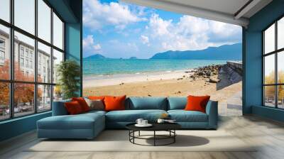 Panoramic coastal Con Dao island view from above, with waves, coastline ,clear sky and road, blue sea and mountain. Wall mural