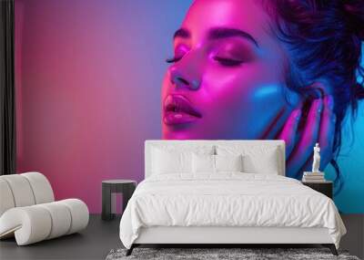 beautiful woman's face on a stylish neon pink and pastel blue background. Wall mural