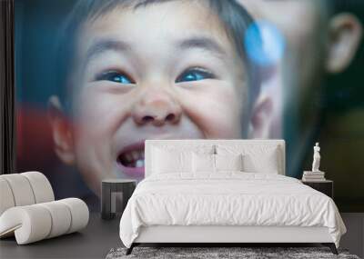 Curious child standing behind the glass and pressing his nose on a glass window Wall mural