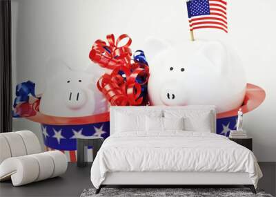 Two patriotic piggy banks sitting in stars and stripes hats. Wall mural