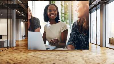 Business women, conversation and laptop data with planning and strategy in office. Training, communication and online chart with corporate tech and working on a teamwork project with diversity Wall mural