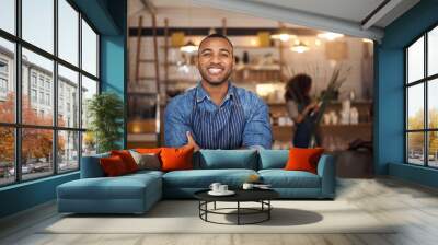 Coffee shop, crossed arms and portrait of black man in restaurant for service, working and happy in cafe. Small business owner, bistro startup and confident male waiter in cafeteria ready to serve Wall mural