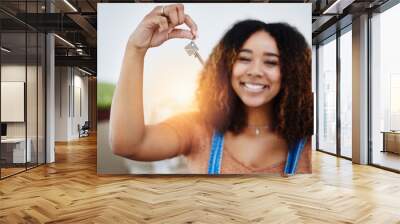 Proper start of adulthood. Cropped shot of a beautiful young woman holding house keys in her new home. Wall mural