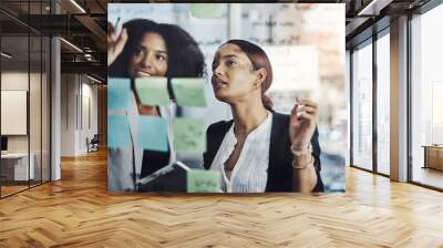 Writing, schedule and meeting by business women planning agenda or calendar and sticky note in office. Teamwork, management and female person team collaboration for solution, strategy and mission Wall mural