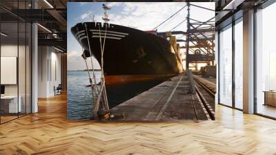 Cargo ship in the harbor at sunset Mauritius Wall mural