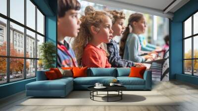 Group of focused children practicing piano in music class with attention and concentration Wall mural