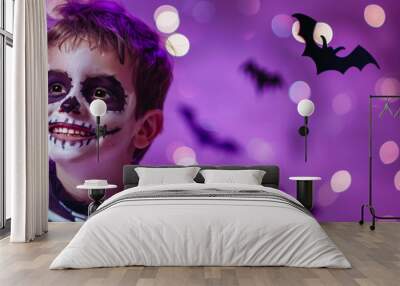 Boy dressed as a cool skeleton at a Halloween party. Wall mural