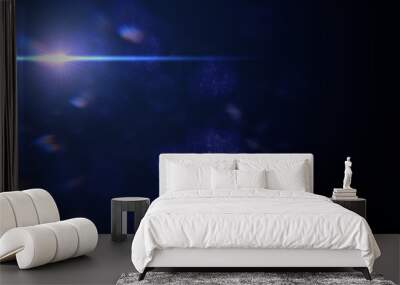 beautiful blue lens flare effect overlay texture with bokeh effect and anamorphic light streak in front of a black background, cinematic format Wall mural