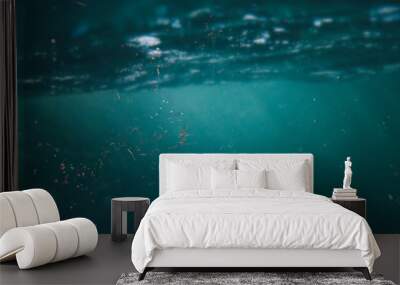 microplastics floating in ocean water, micro plastic pollution Wall mural