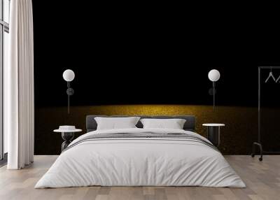 twinkling golden glitter on a flat surface  lit by a bright spotlight (on black background) Wall mural