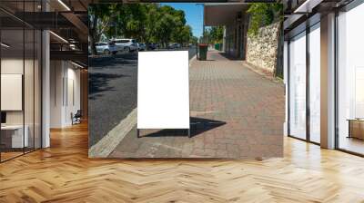 Background texture of a blank white advertisement board on walkway. Mockup template of a standing easel on pedestrian sidewalk in an small Australian regional town. Wall mural