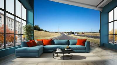 View of a road merging to the highway at the outskirt of Melbourne's urban area. Background texture of the Australian motorway with some cars in the distance.  M31 Hume Freeway VIC Australia, Wall mural