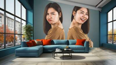 bipolar disorder personality. Asian woman face happy and depressed moods   Wall mural