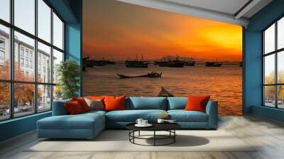 Fishing boats during a beautiful and colorful sunset in Juan Griego beach, Margarita Island. Venezuela Wall mural