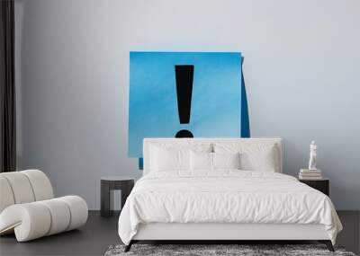 Blue Sticky Note with Exclamation Mark on White Background Wall mural