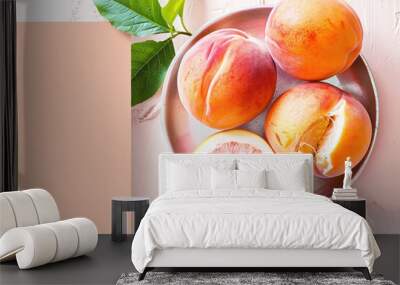 Fresh peaches on a rustic plate create a photogenic display that pops with natural color Wall mural