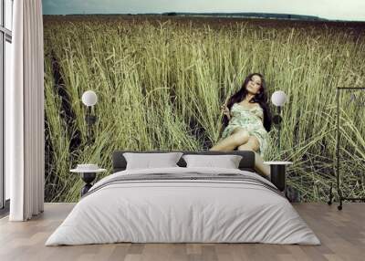 Young woman in the meadow Wall mural