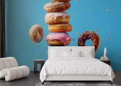 colorful donuts on a blue background Wall mural