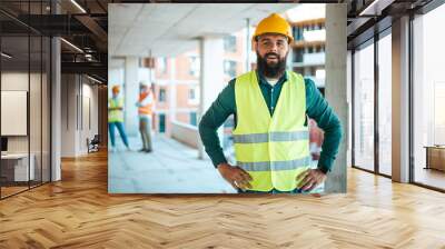 Confident Construction Worker on Building Site with Team Wall mural