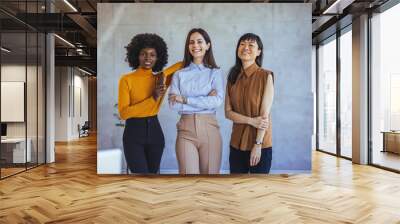 Confident Diverse Women in Professional Attire Smiling Together Wall mural