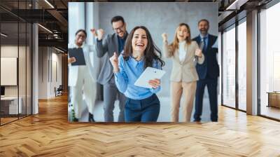 Excited happy multiracial businesspeople have fun engaged in activity in office together, overjoyed diverse colleagues dance celebrate successful business project, Friday celebration concept Wall mural